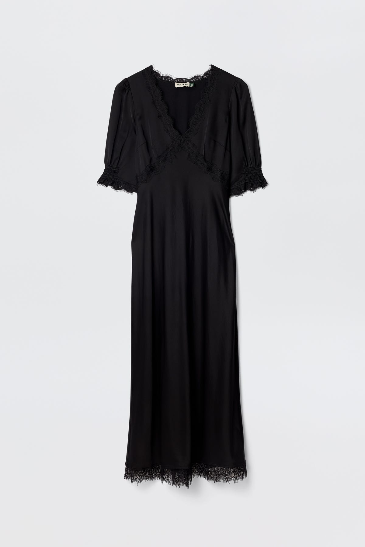 Annina - Black: A bias-cut black midi dress with lace trims on the V-neckline, sleeves, and hem. The short-sleeved, ankle-length silhouette is showcased elegantly against a plain white background.