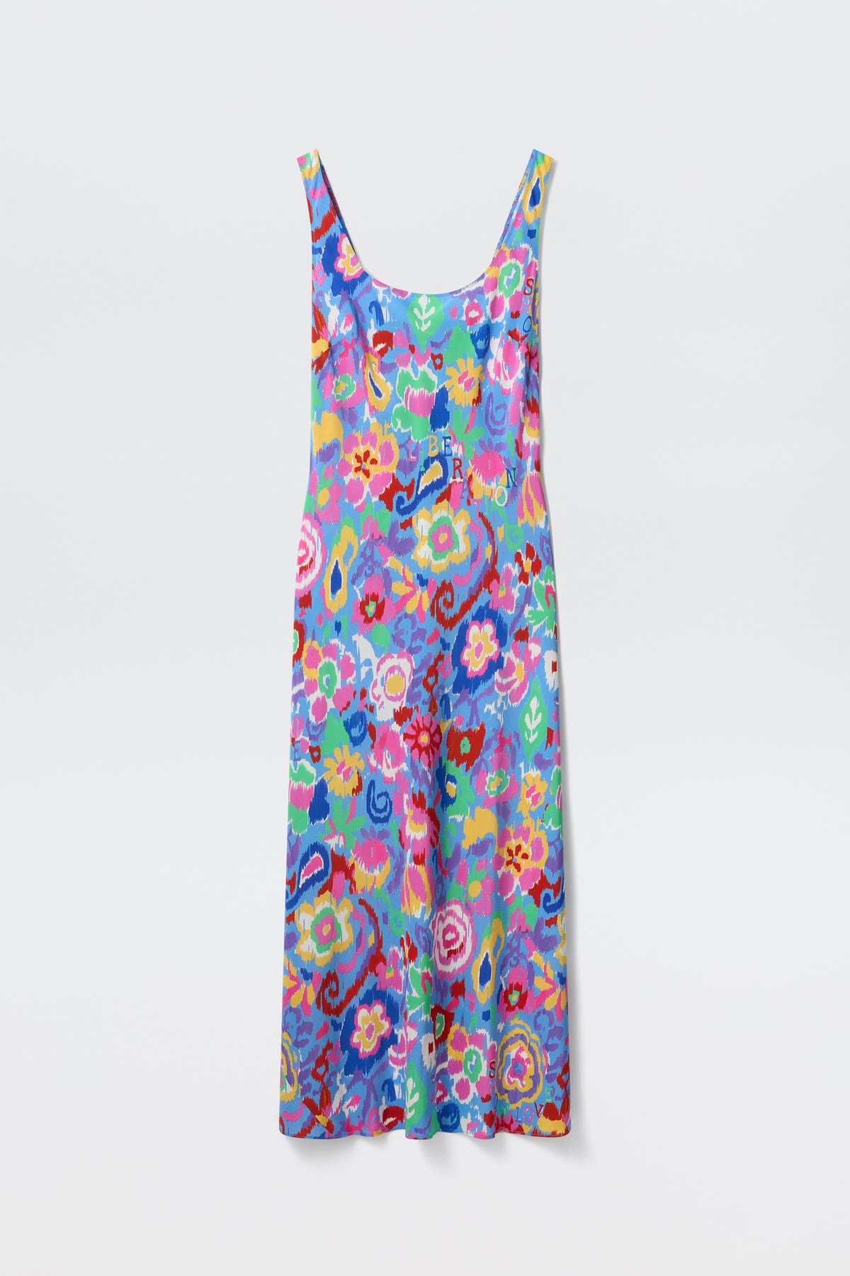 The Bondi - Ikat Bloom Lilac is a sleeveless, ankle-length dress featuring a colorful floral pattern in blue, pink, yellow, green, and red hues, displayed on a plain white background.