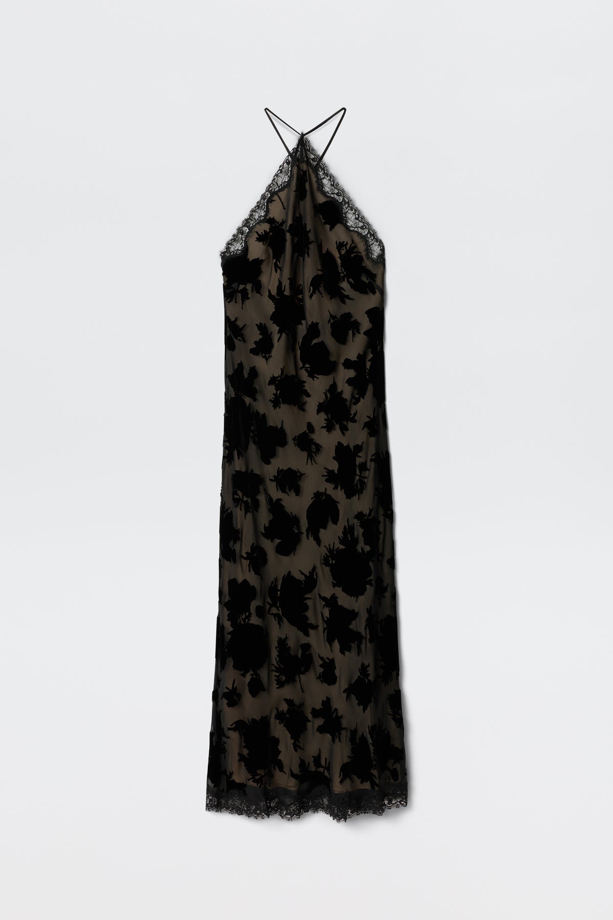 The Harlan - Countryside Devore Mono is a long, sleeveless dress featuring thin spaghetti straps, black lace trim, and sheer nude fabric with black floral velvet patterns. Displayed against a plain white background.