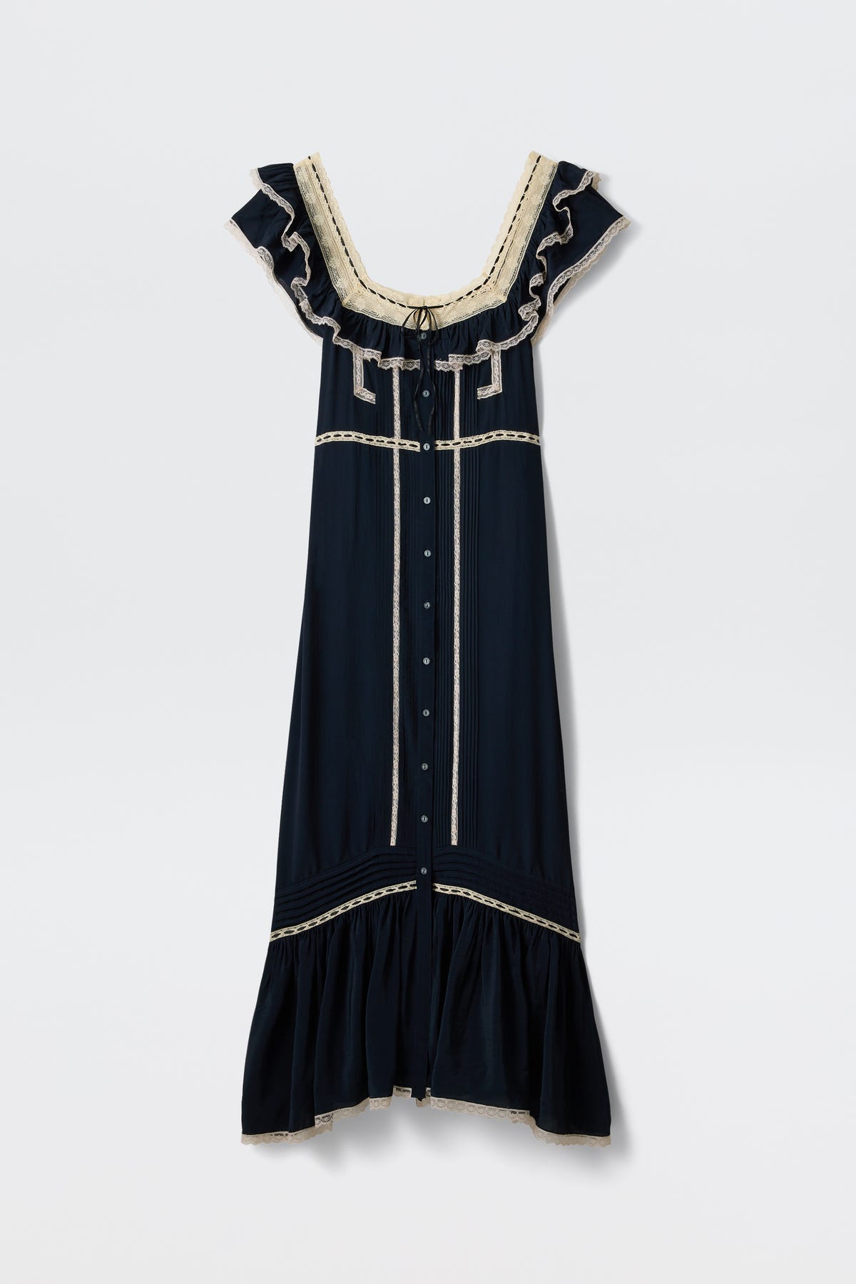 The Kendara - Deep Navy is a prairie-inspired midi dress in dark navy cotton, featuring cream lace trim, ruffled cap sleeves, a square neckline, button-down front, and flounced hem. Shown against a plain white background.