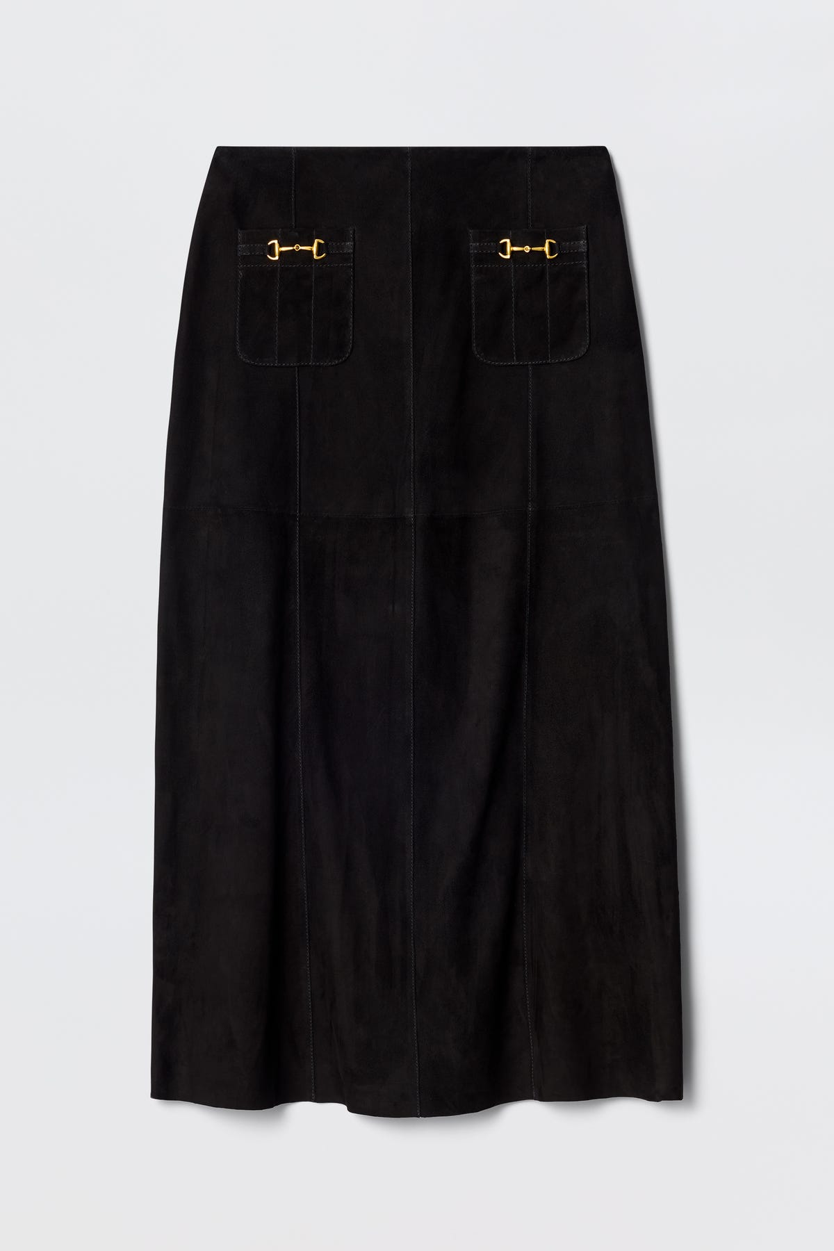 The Edwina - Black is a vintage-inspired black suede skirt featuring two front patch pockets with decorative gold buckles, a straight silhouette, and subtle vertical seam lines for timeless appeal.