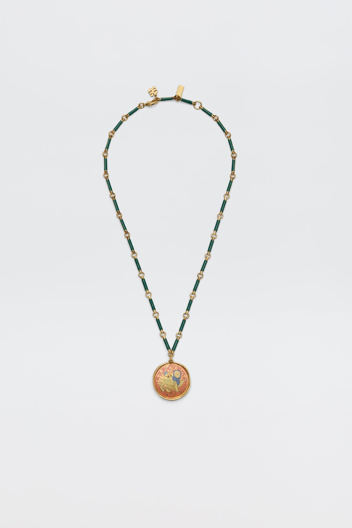 The Ari - Astro Leo necklace features gold and green beads with a circular pendant showcasing a vibrant, intricate design; displayed on a plain white background, this striking zodiac piece brings personality and charm to any look.