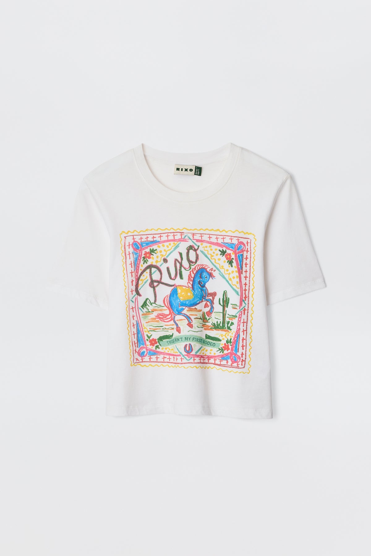 The Ria - Rider White T-shirt is a white cropped cotton-jersey top with a colorful front graphic featuring a blue horse, cacti, flowers, and "Rixo" in decorative script above the hem.