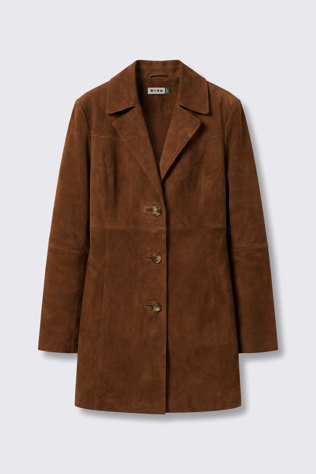 Lainey - Chestnut: A brown suede women’s coat featuring a notched lapel collar, long sleeves, three front buttons, and a tailored fit, showcased against a plain light gray background.