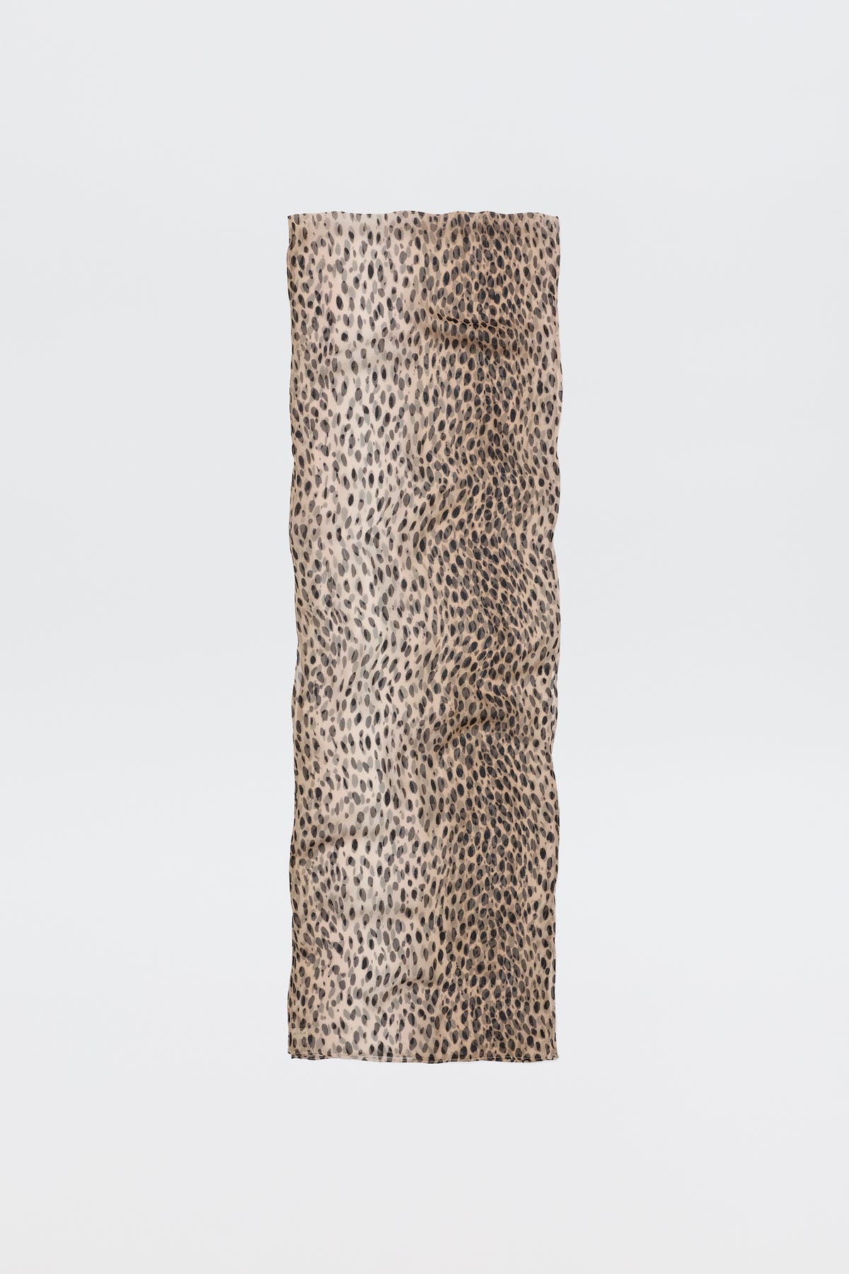 The Julien Scarf Antelope Spot Black features a rectangular crinkled-georgette fabric with a beige base and black irregular antelope spots, shown on a plain white background—perfect for expressing your wild side.