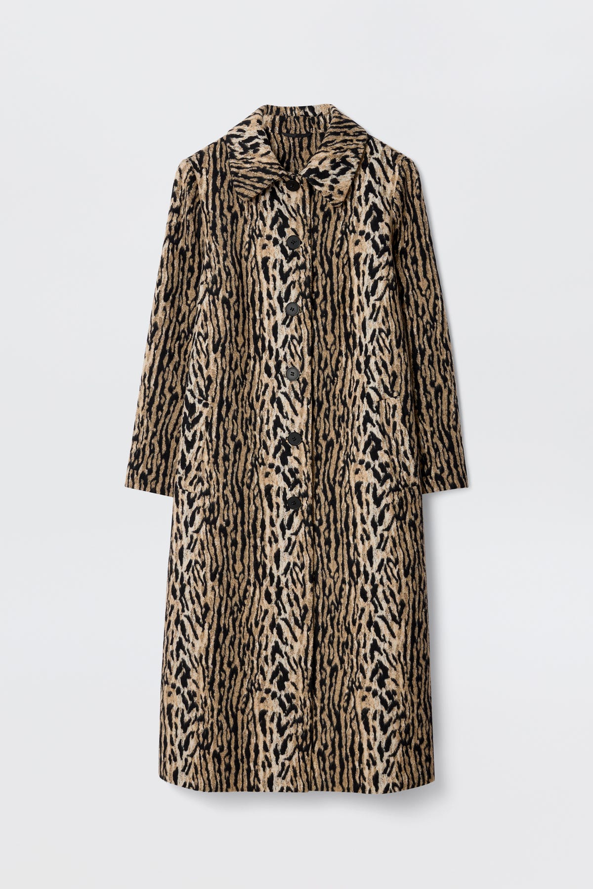 The Milly - Bohemia Leopard is a mid-length coat in tan and black with a bold leopard print, wide collar, and long felt fur sleeves, shown against a plain white background.