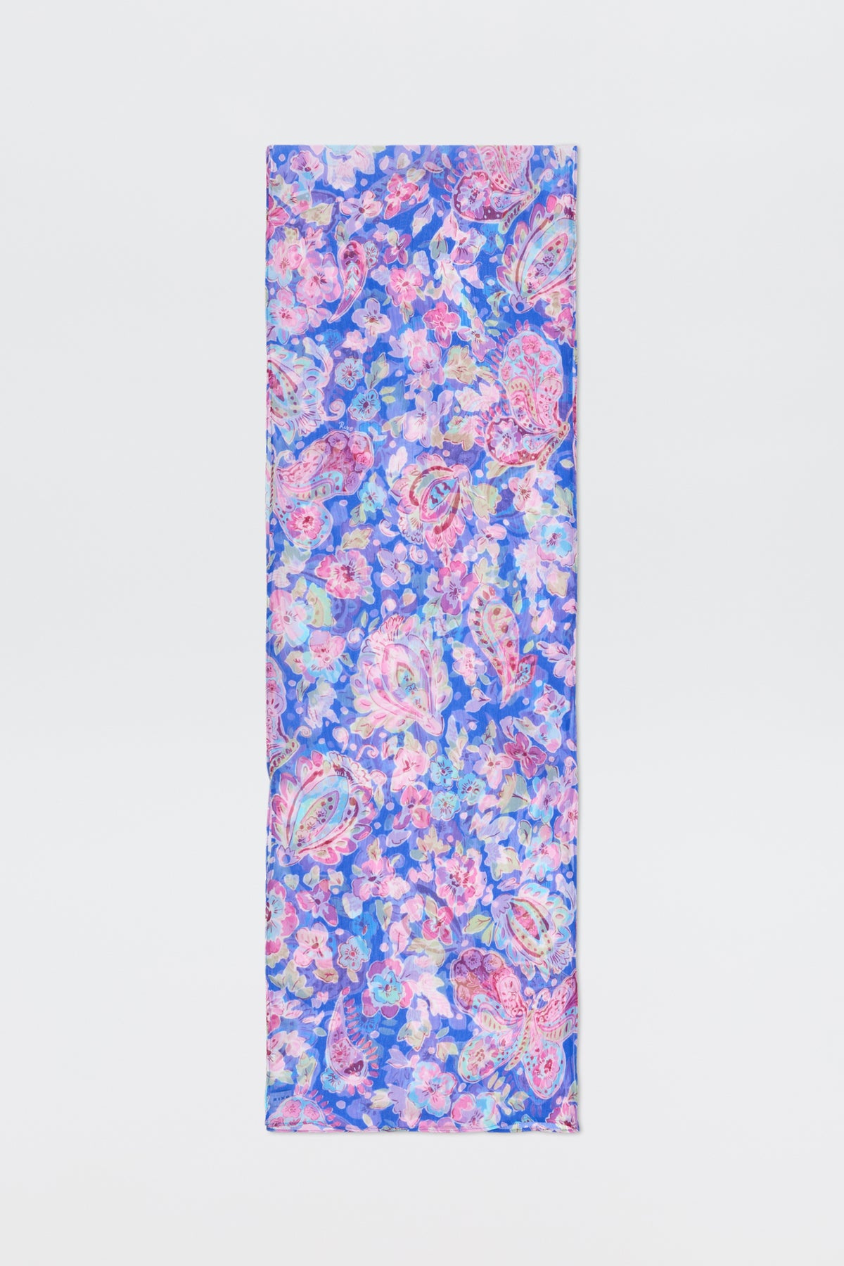 The Julien - Cara Floral Blue scarf features a vibrant floral and paisley design in blue, pink, and purple tones, shown on a plain white background.