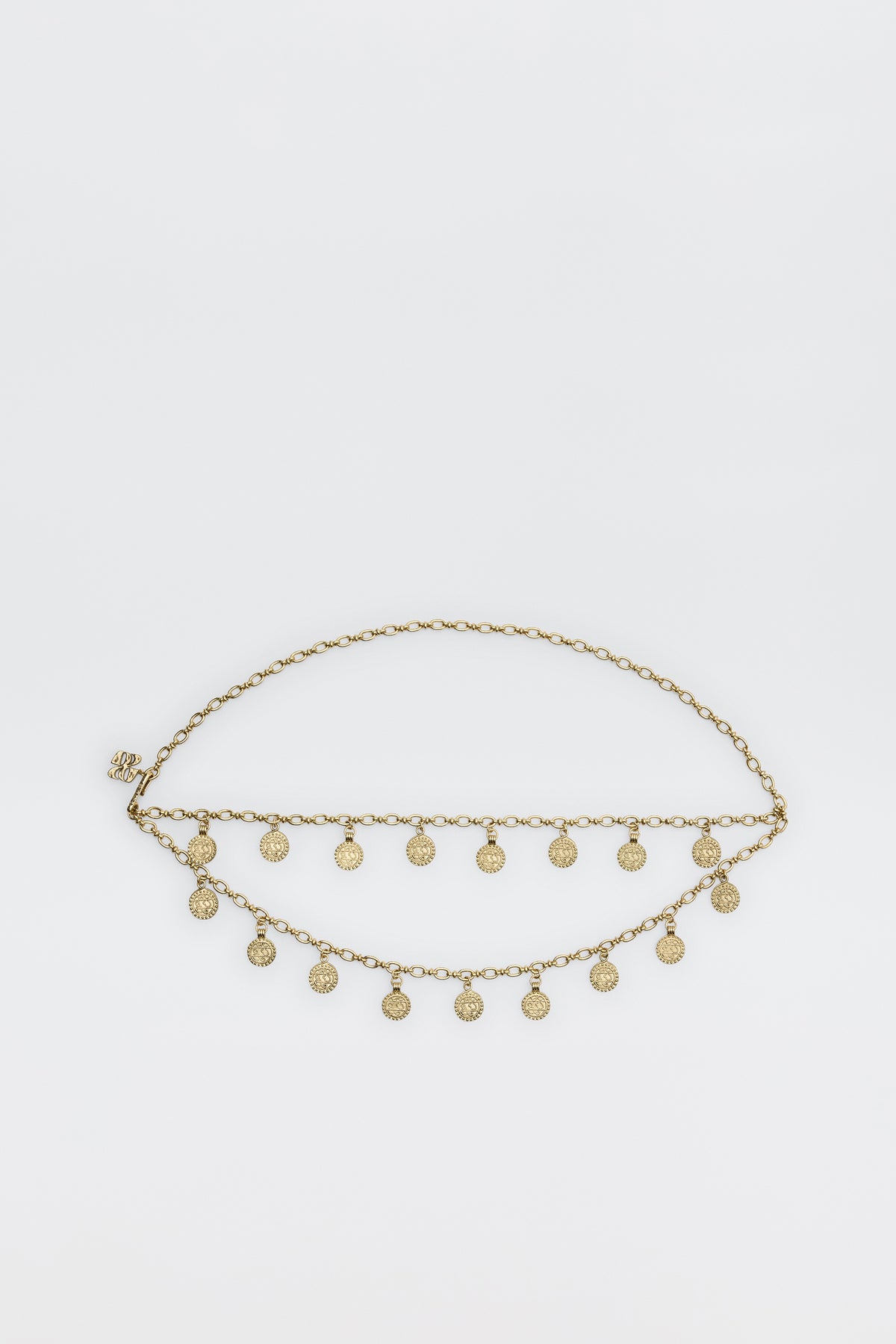 The Lita - Gold is a two-row chain belt featuring evenly spaced small round coin charms, shown against a plain white background.