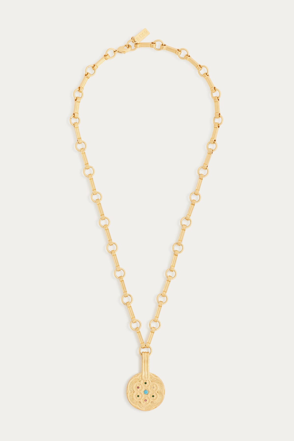 The Sol - Gold chain necklace features a large Sol pendant adorned with small colored stones, linked by oval and round gold chains—ideal for bohemian jewelry lovers. Shown against a plain white background.