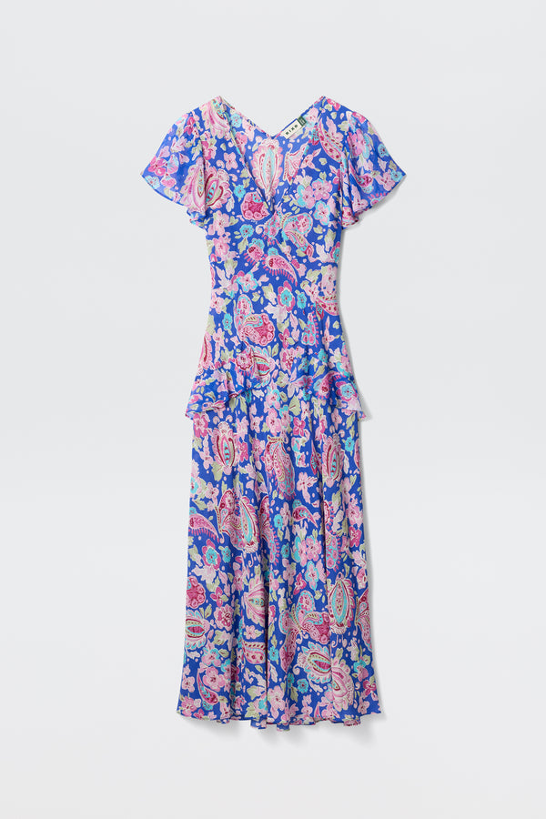 The Evie - Cara Floral Blue is an ankle-length dress featuring short flutter sleeves and a floral paisley print in blue, pink, and purple, shown against a plain white background.