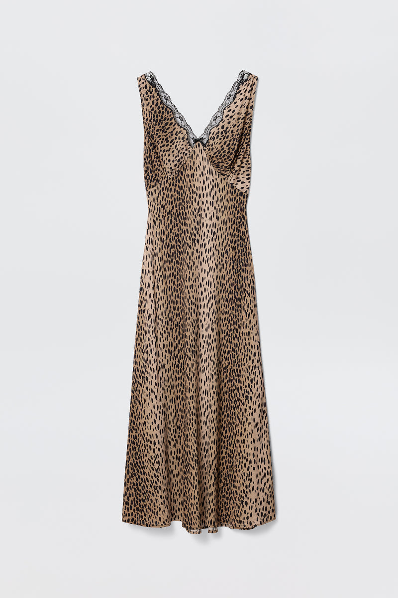 The Sandrine - Antelope Spot Black slip dress by RIXO is sleeveless with a V-neckline trimmed in black lace and features an antelope spot print, shown on a plain white background.