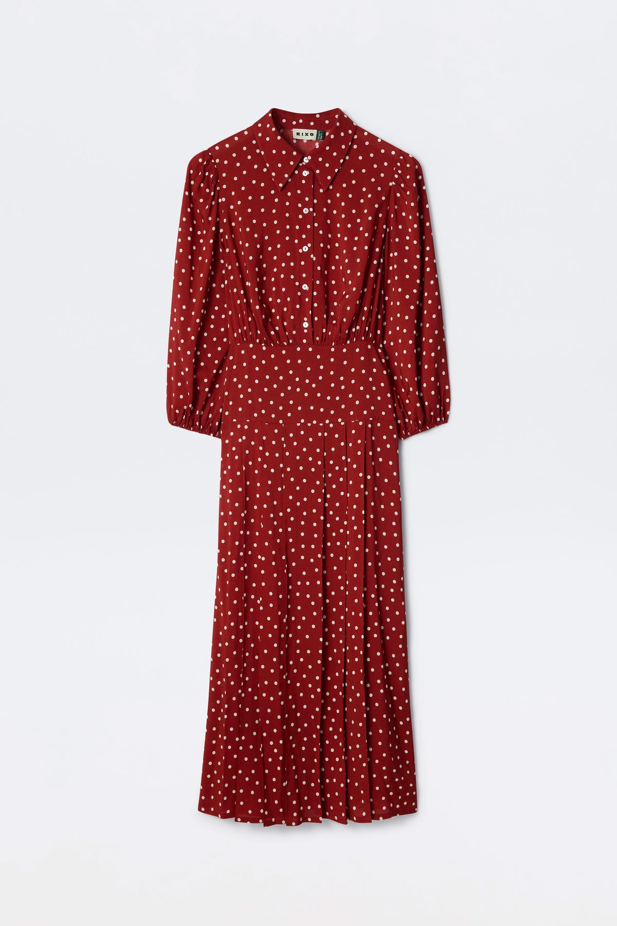 The Izzy - Layla Dot Red is a deep red, long-sleeved midi dress with white polka dots, a button-up front, collared neckline, and a fitted waist.