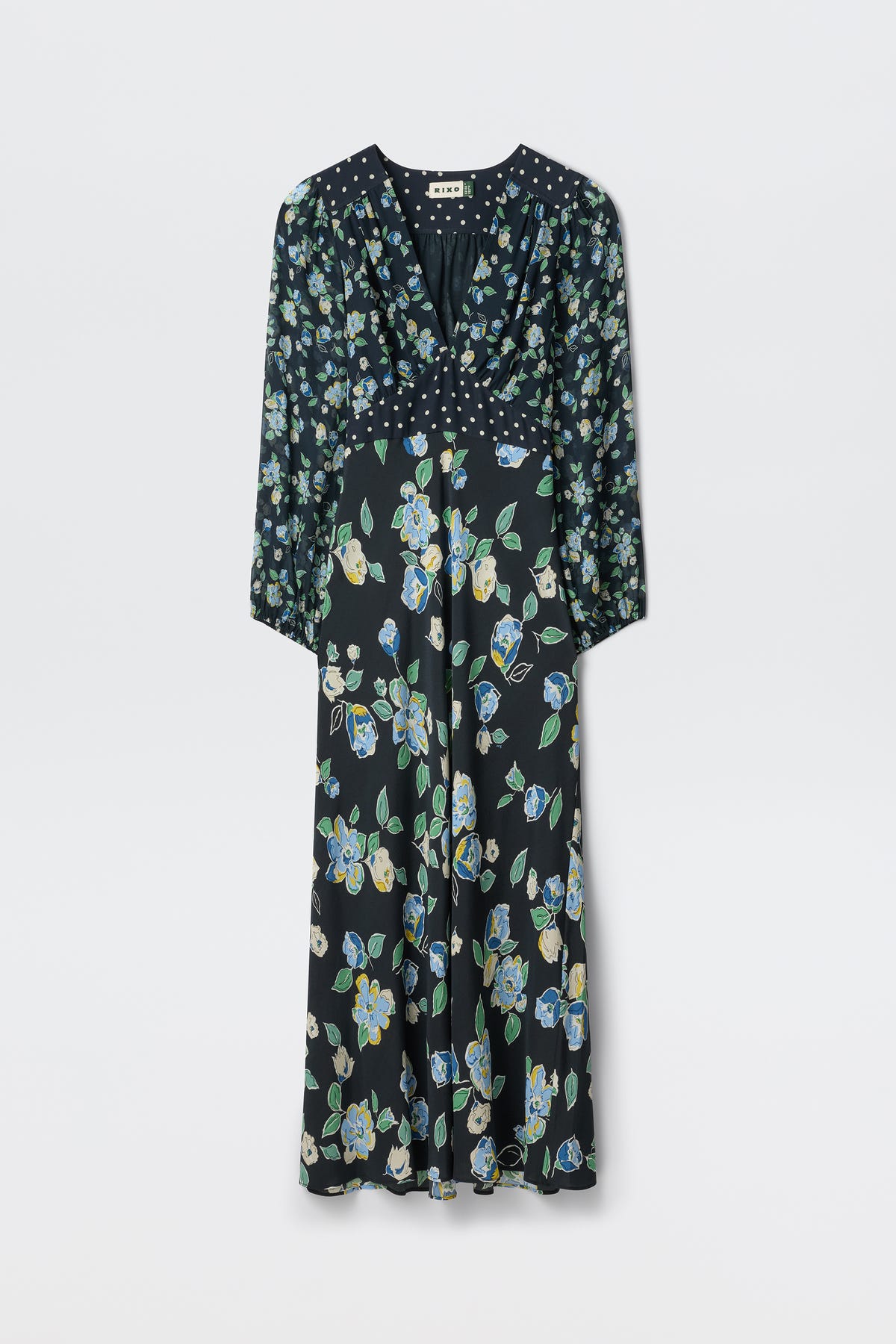 The Kaila - Layla Mix Navy is an ankle-length, long-sleeved black dress with a V-neckline. It features small white polka dots on the top and blue, green, and yellow floral prints on the skirt.