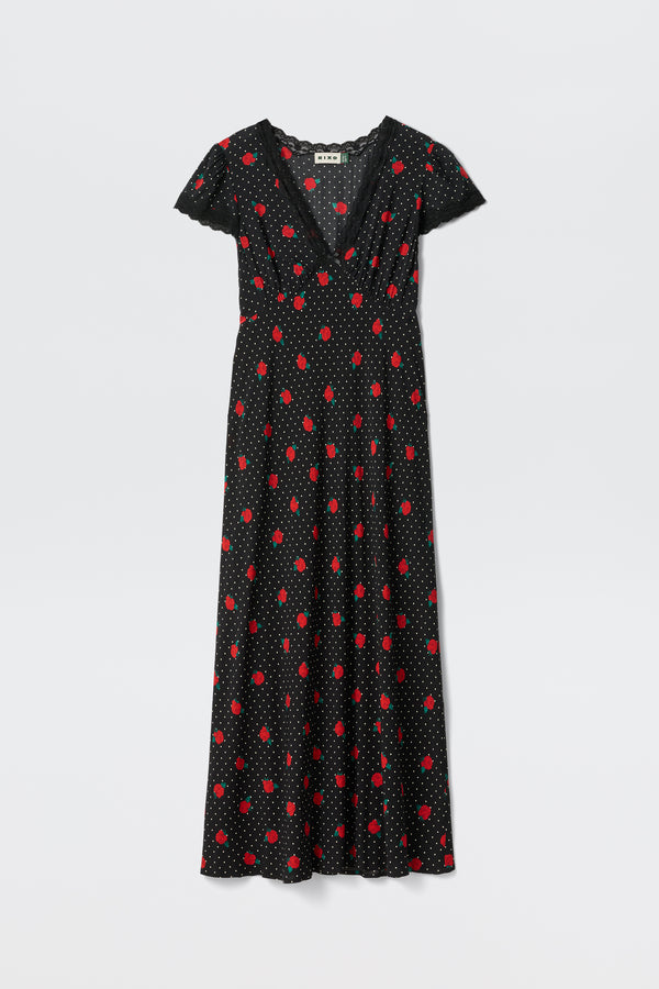 The Clarice - Rose Spot Black is a black V-neck, short-sleeve maxi dress featuring red polka dots and smaller white dots, shown on a plain white background.