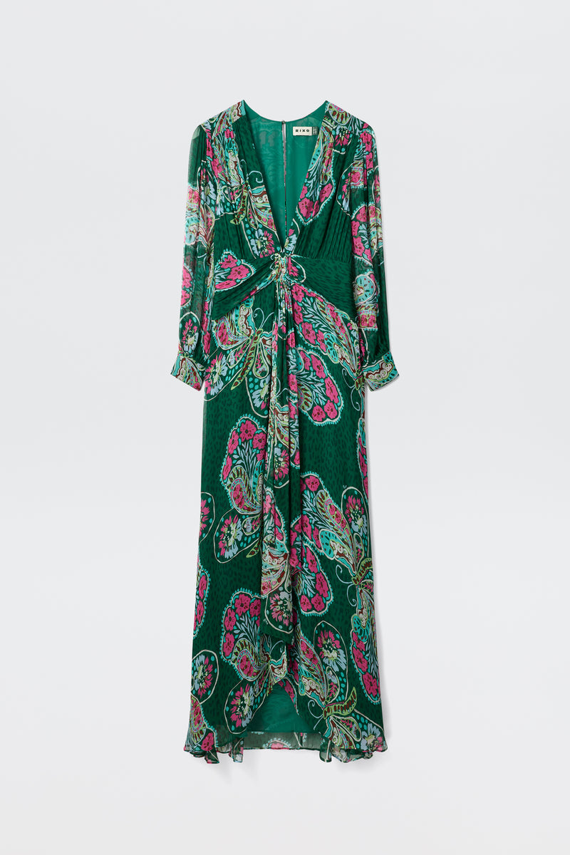 The Meera - Butterfly Bloom Green is a long-sleeved maxi dress with a green base, colorful pink and light green paisley print, V-neckline, gathered waist, and flowing skirt.