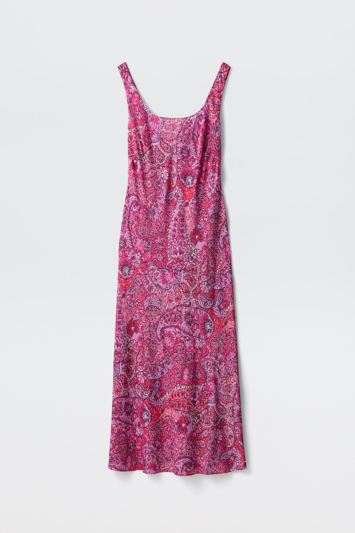 A sleeveless, long red dress with thin straps and a colorful paisley floral pattern, displayed flat against a plain white background.
