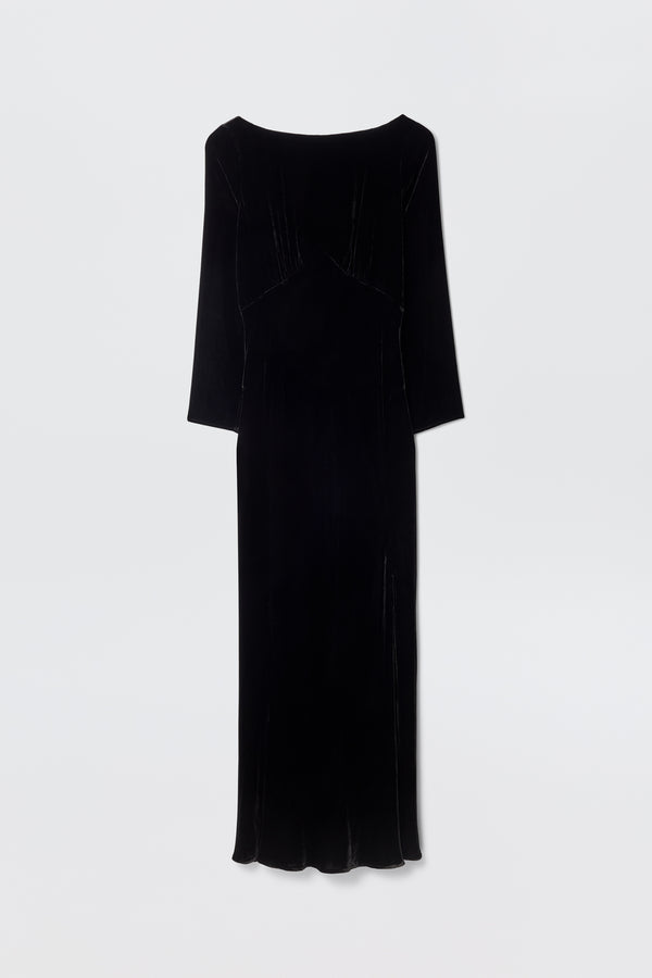 The Devina - Black is an elegant long-sleeved, floor-length black velvet gown with a high neckline and slightly fitted silhouette, shown against a plain white background.