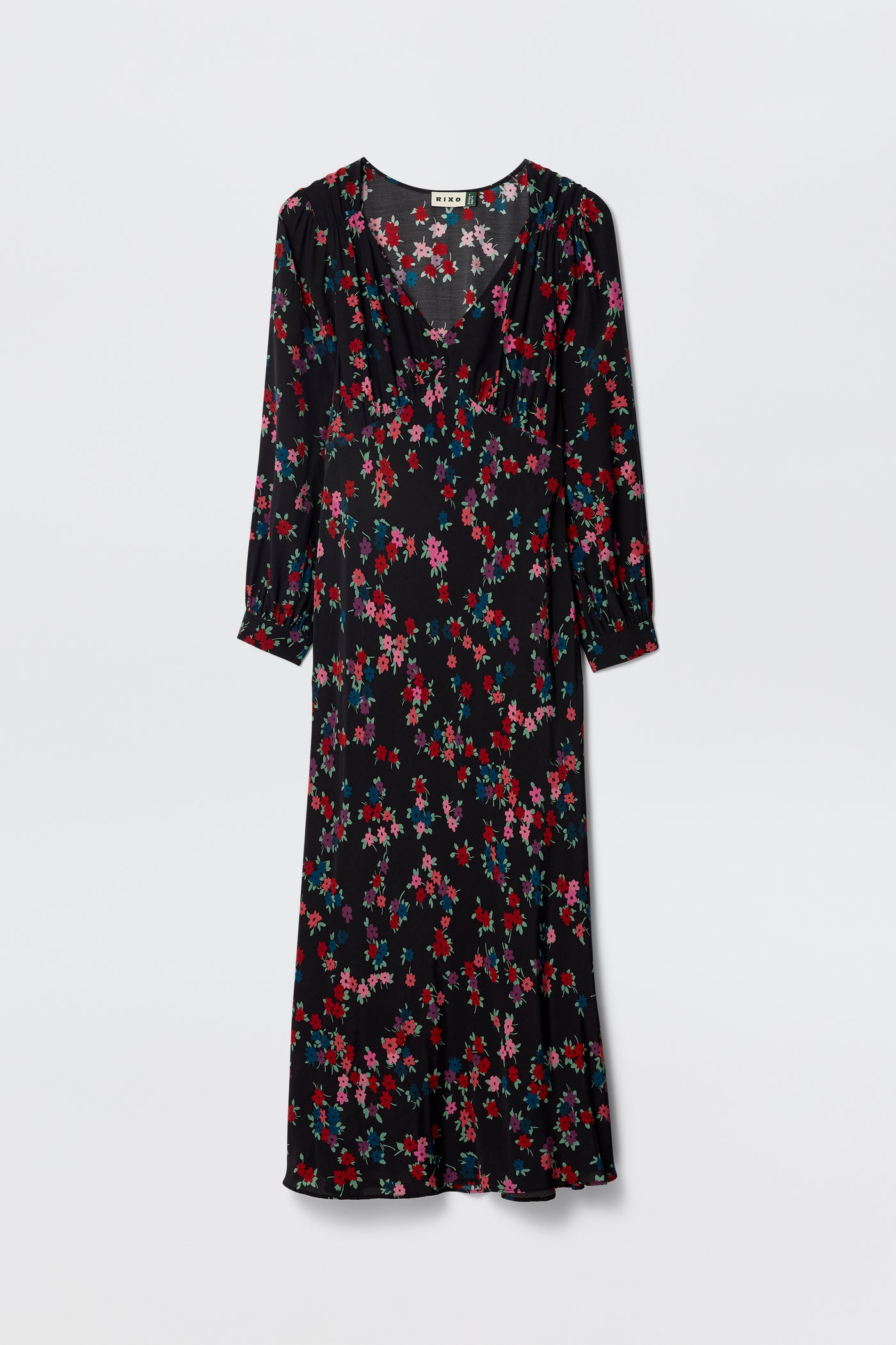 The Mavis - City Floral Black is a knee-length black silk Crepe de Chine dress with long sleeves and a vibrant floral print in red, pink, purple, and green—ideal for any occasion. Shown here against a plain white background.
