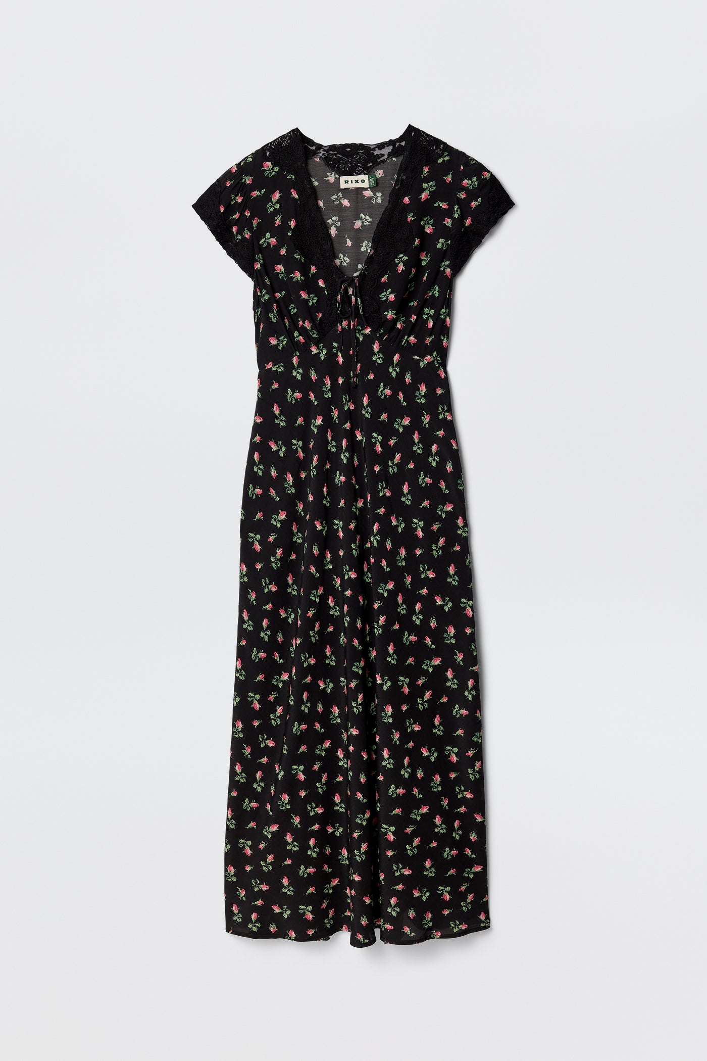 The Amari - Sienna Bud Black is a black bias-cut dress with short sleeves, a V-neckline, and a red and green Sienna Bud print. Its relaxed fit and lightweight fabric offer effortless elegance.