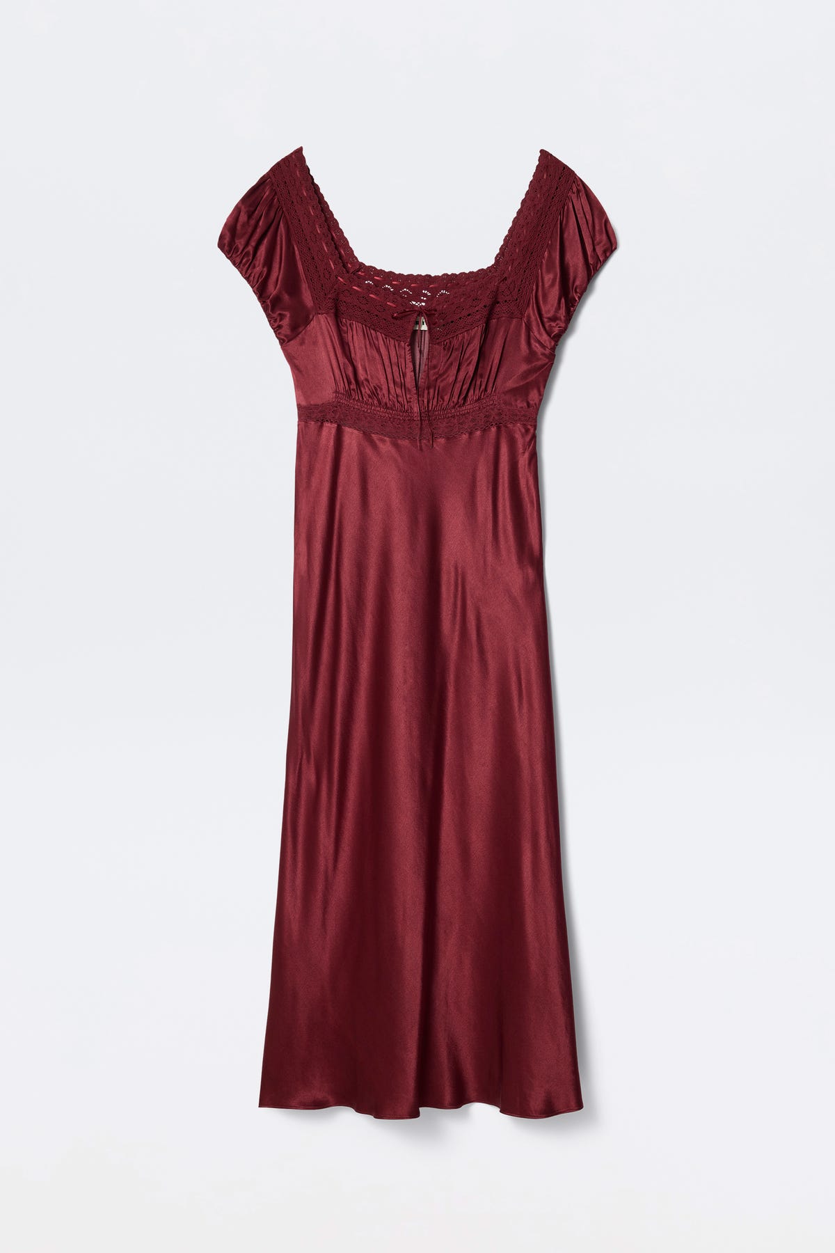 The Maeva - Maroon is a burgundy satin dress with short sleeves, lace-trimmed square neckline, gathered bust detail, and a slightly flared skirt, shown against a plain white background.