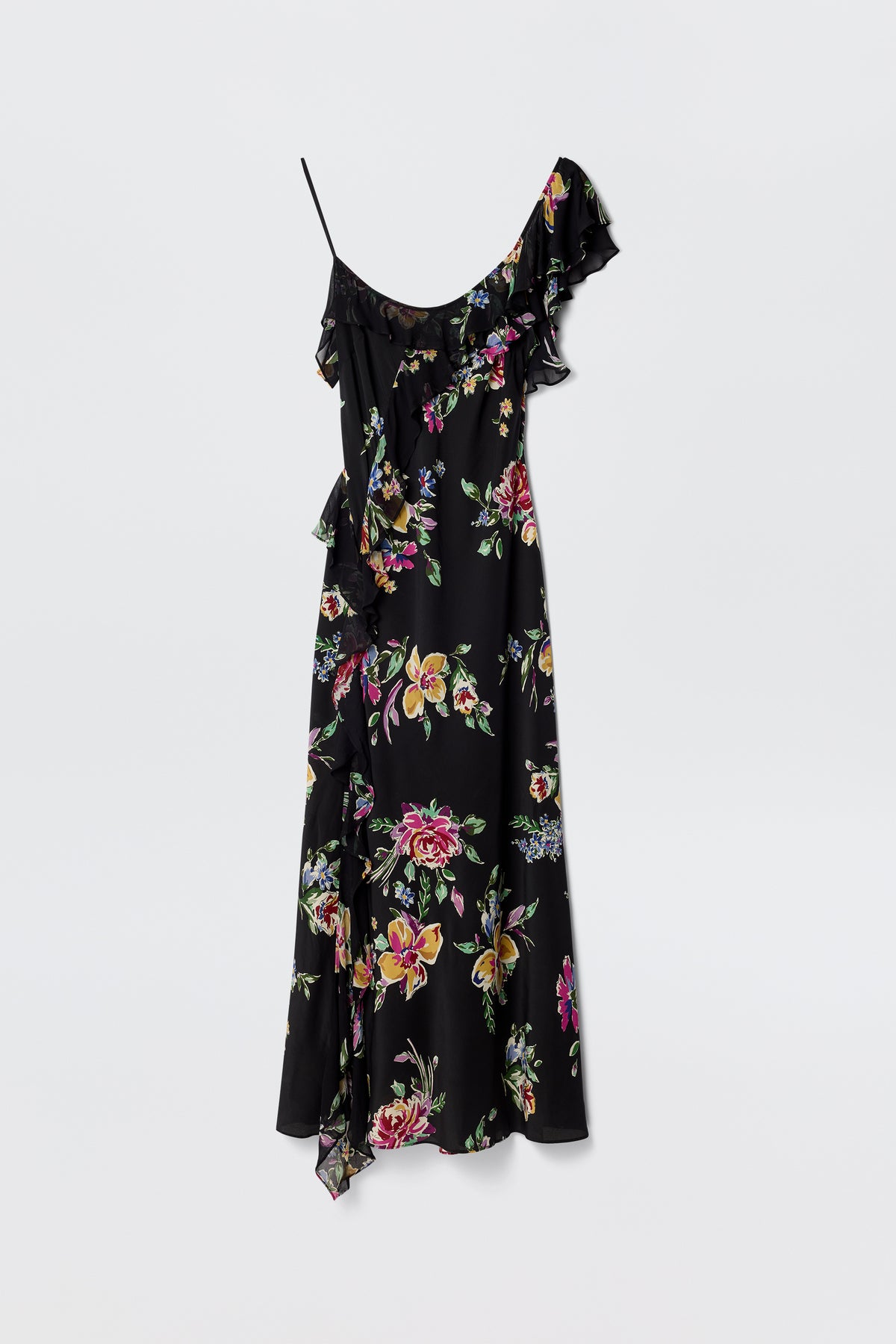 The Ester - Vintage Bloom Black is a black one-shoulder dress featuring a ruffled neckline, pink, yellow, and green jacquard florals, an asymmetrical hem, vintage-inspired charm, and a single thin strap.
