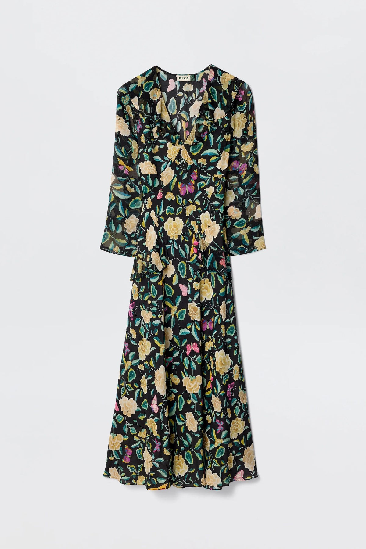 The Cedar - Butterfly Floral Charcoal is a long-sleeved, silk midi dress with an empire waist and colorful yellow, green, and pink floral print, shown against a plain white background.