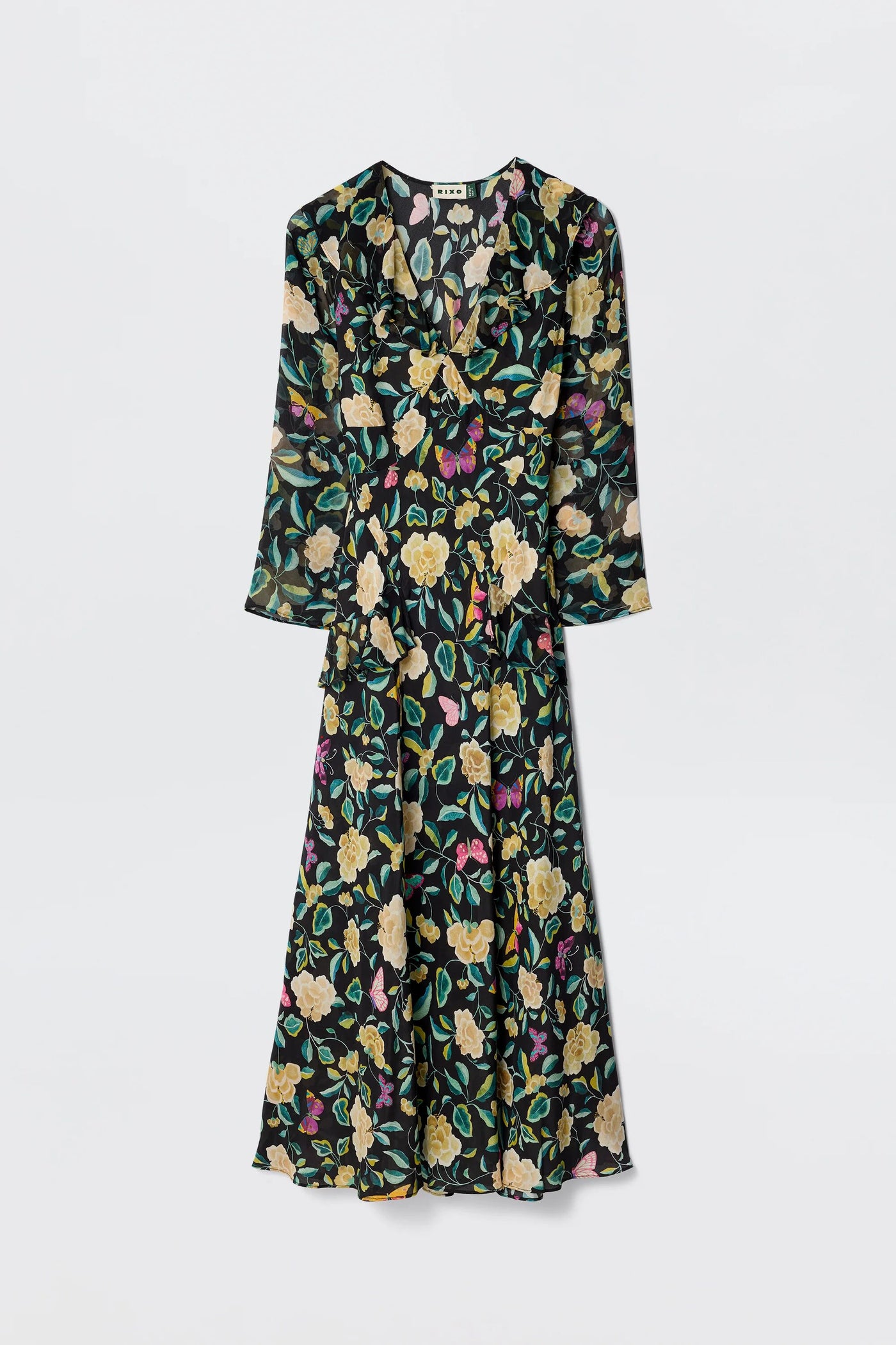 The Cedar - Butterfly Floral Charcoal is a long-sleeved, silk midi dress with an empire waist and colorful yellow, green, and pink floral print, shown against a plain white background.