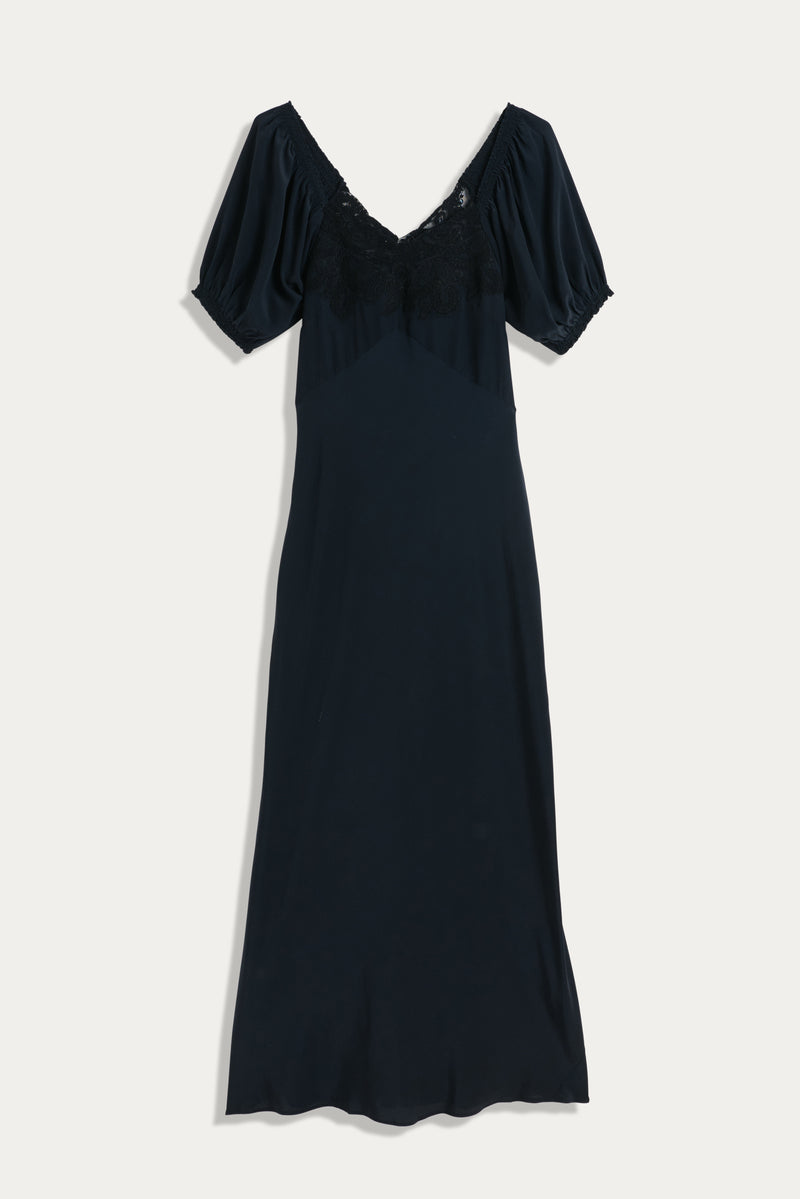 The Ilaria - Black dress is a short-sleeve midi with a V-neckline, delicate lace details, and gathered puff sleeves, shown laid flat on a white background.