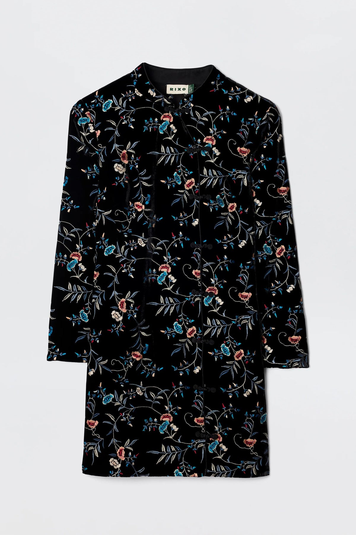 The Delphina - Botanical Embroidery Black is a long-sleeved, black velvet-silk dress coat featuring colorful red, blue, and green floral and leaf patterns, displayed flat against a plain light background.