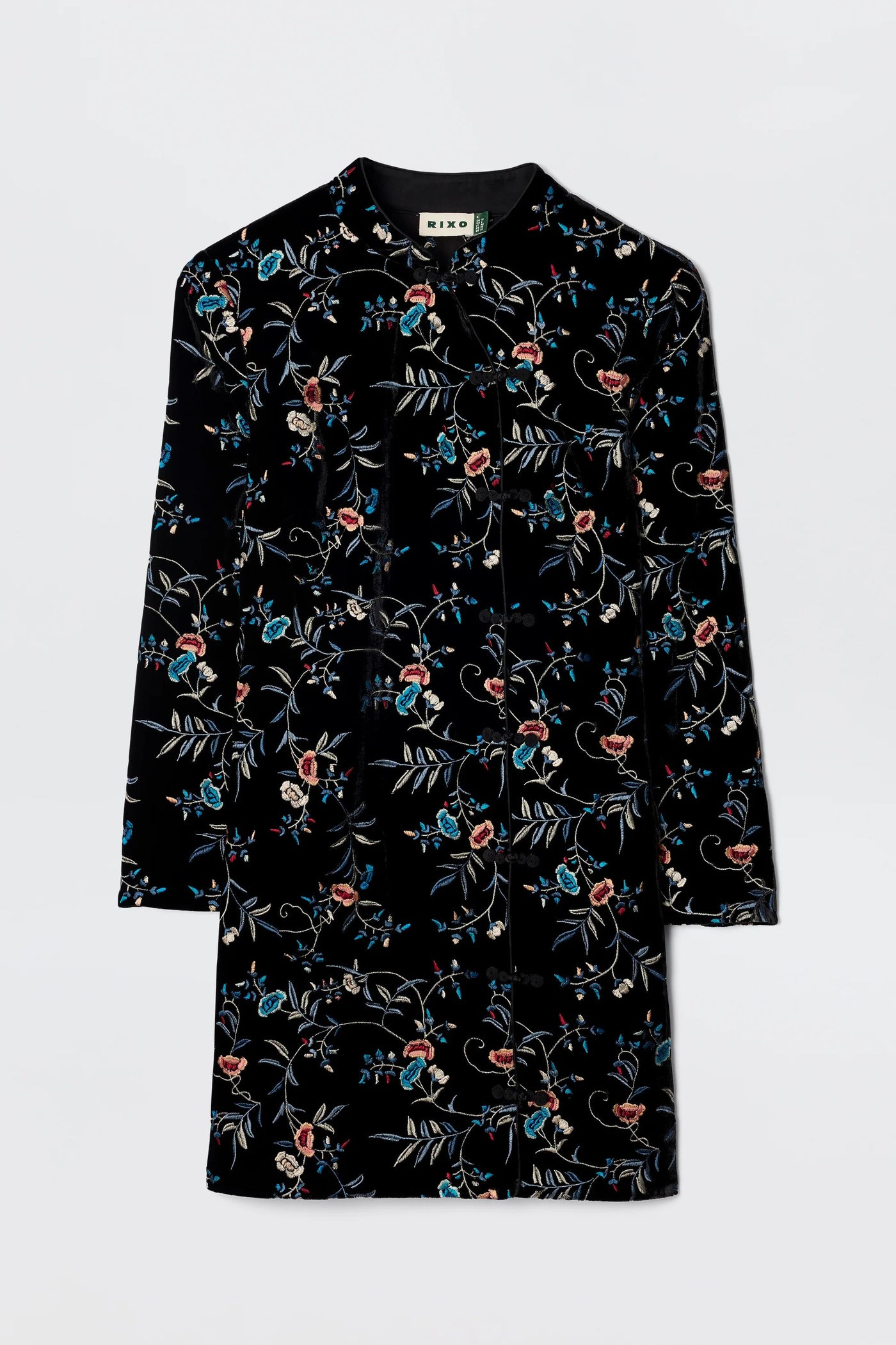 The Delphina - Botanical Embroidery Black is a long-sleeved, black velvet-silk dress coat featuring colorful red, blue, and green floral and leaf patterns, displayed flat against a plain light background.
