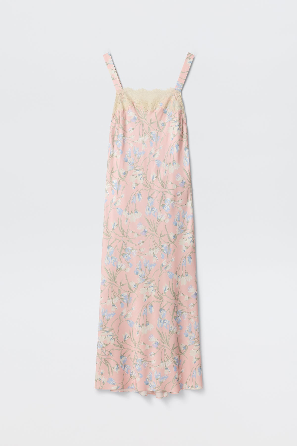The Rosamarie - Watercolour Floral Pink is a long, sleeveless nightgown with thin straps, showcasing a light pink base with blue and white watercolor floral patterns and cream lace trim along the top.