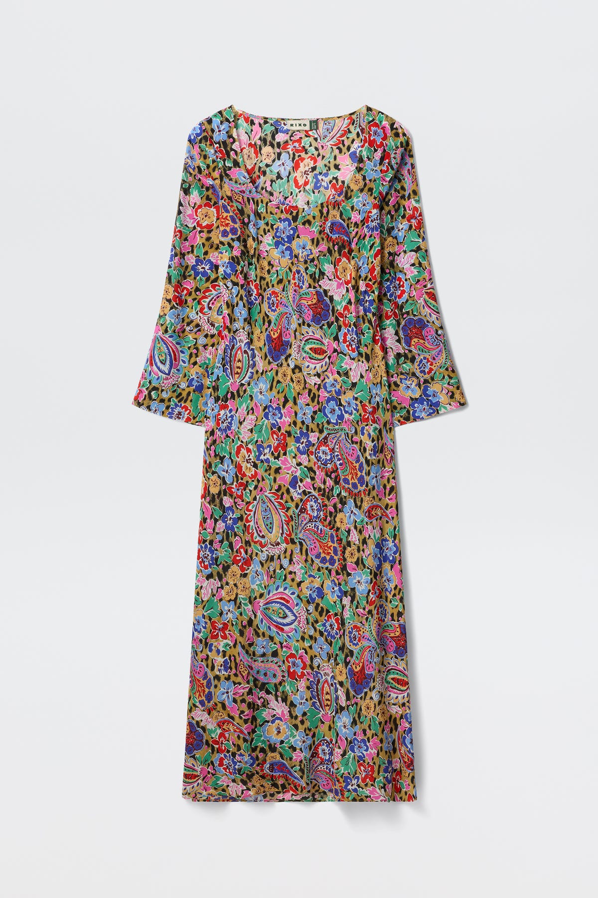 A long-sleeve, ankle-length Noraya - Cara Floral Leopard Brown dress with a colorful floral and paisley pattern on lightweight fabric, displayed on a white background.