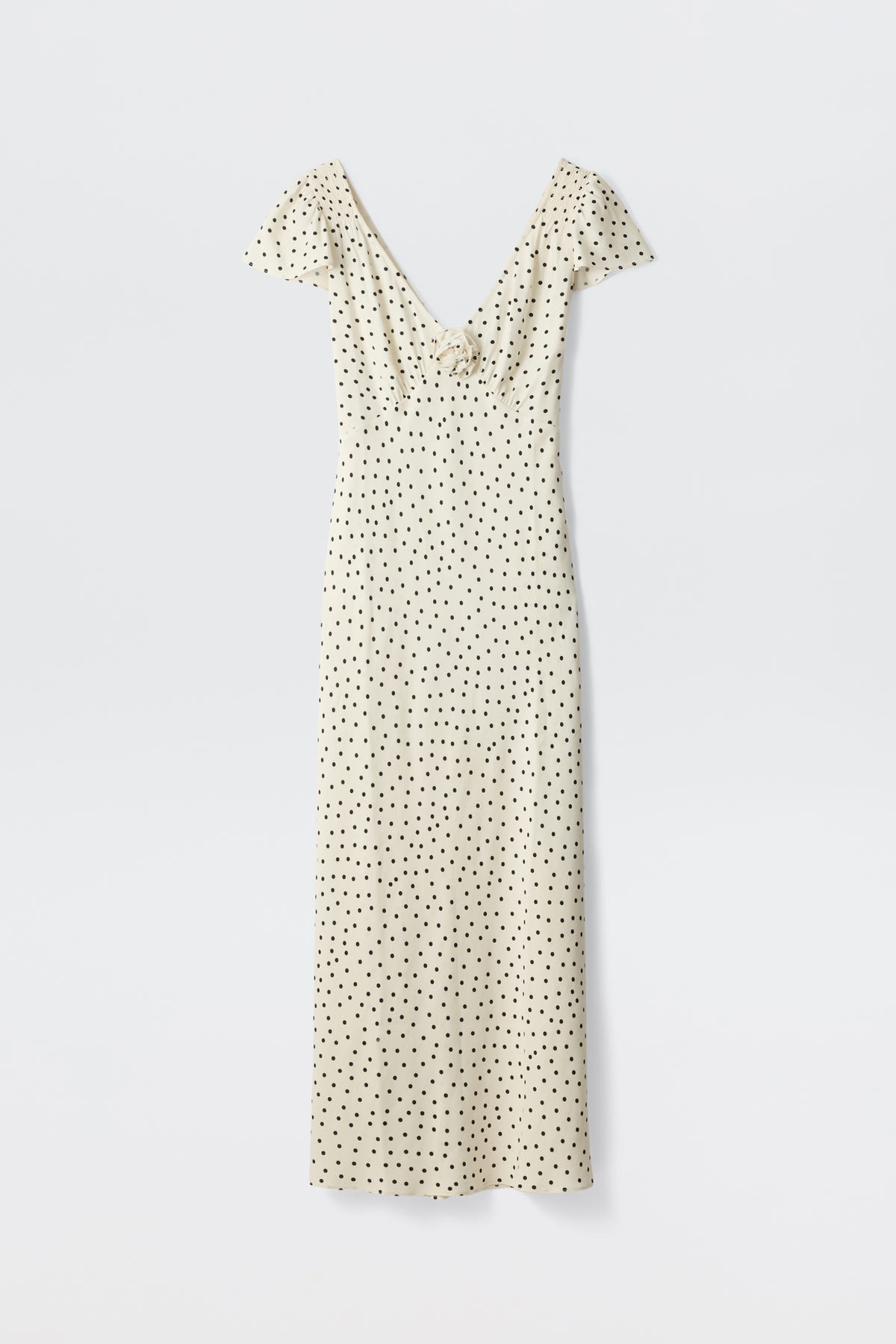 The Cathy - Layla Dot Ivory is a cream-colored, short-sleeved, ankle-length dress with black polka dots and a deep V-neckline, laid flat on a white background.