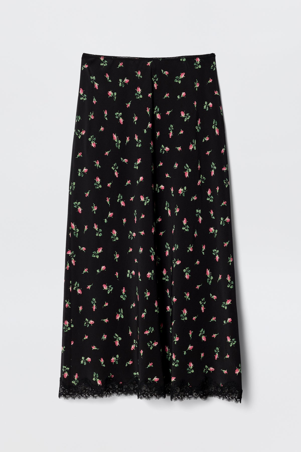 The Stassie - Sienna Bud Black is a vintage-inspired black midi skirt featuring a pink and green floral pattern and lace-trimmed hem. Its lightweight fabric and relaxed, flared fit make it perfect for co-ord styling.