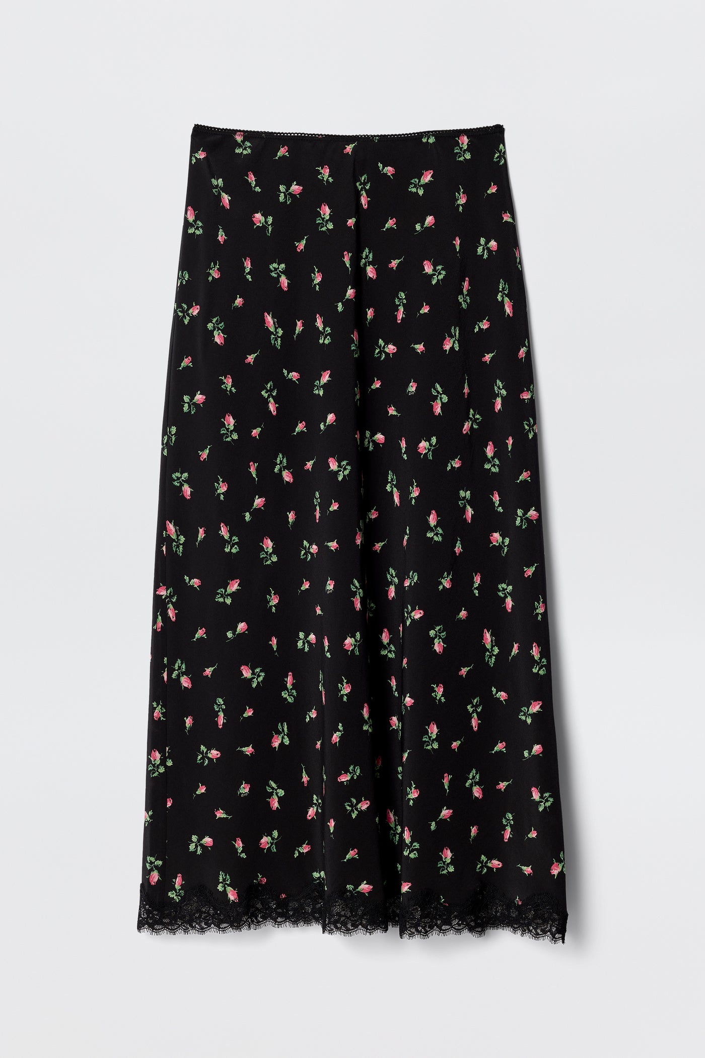The Stassie - Sienna Bud Black is a vintage-inspired black midi skirt featuring a pink and green floral pattern and lace-trimmed hem. Its lightweight fabric and relaxed, flared fit make it perfect for co-ord styling.