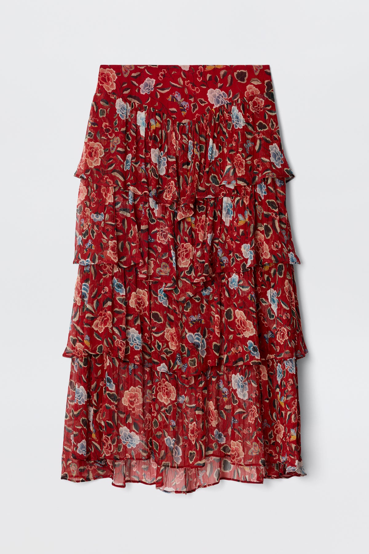 The Taryn - Butterfly Floral Burgundy is a knee-length prairie skirt in lightweight, crinkled georgette with tiered ruffles, a red base, and a butterfly floral print in pink, blue, and green. The fabric is slightly sheer.