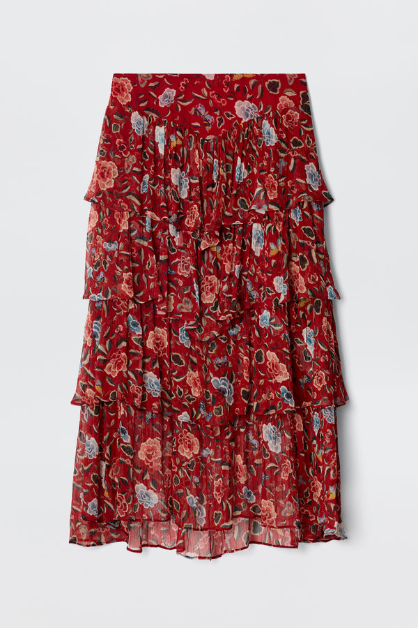 The Taryn - Butterfly Floral Burgundy is a knee-length prairie skirt in lightweight, crinkled georgette with tiered ruffles, a red base, and a butterfly floral print in pink, blue, and green. The fabric is slightly sheer.