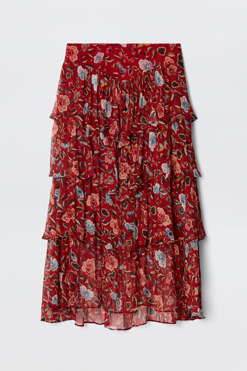 The Taryn - Butterfly Floral Burgundy is a knee-length prairie skirt in lightweight, crinkled georgette with tiered ruffles, a red base, and a butterfly floral print in pink, blue, and green. The fabric is slightly sheer.