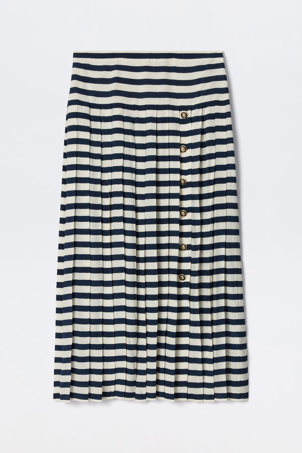 The Una - Lea Stripe Navy is a knee-length pleated skirt with horizontal navy and white stripes and a row of five buttons down the right side.