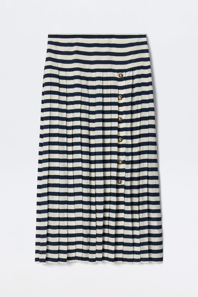 The Una - Lea Stripe Navy is a knee-length pleated skirt with horizontal navy and white stripes and a row of five buttons down the right side.