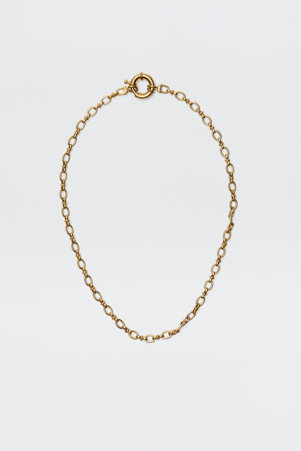 The Lorene - Gold is a vintage-inspired gold-plated necklace with oval links and a round spring ring clasp, elegantly showcased against a plain white background.