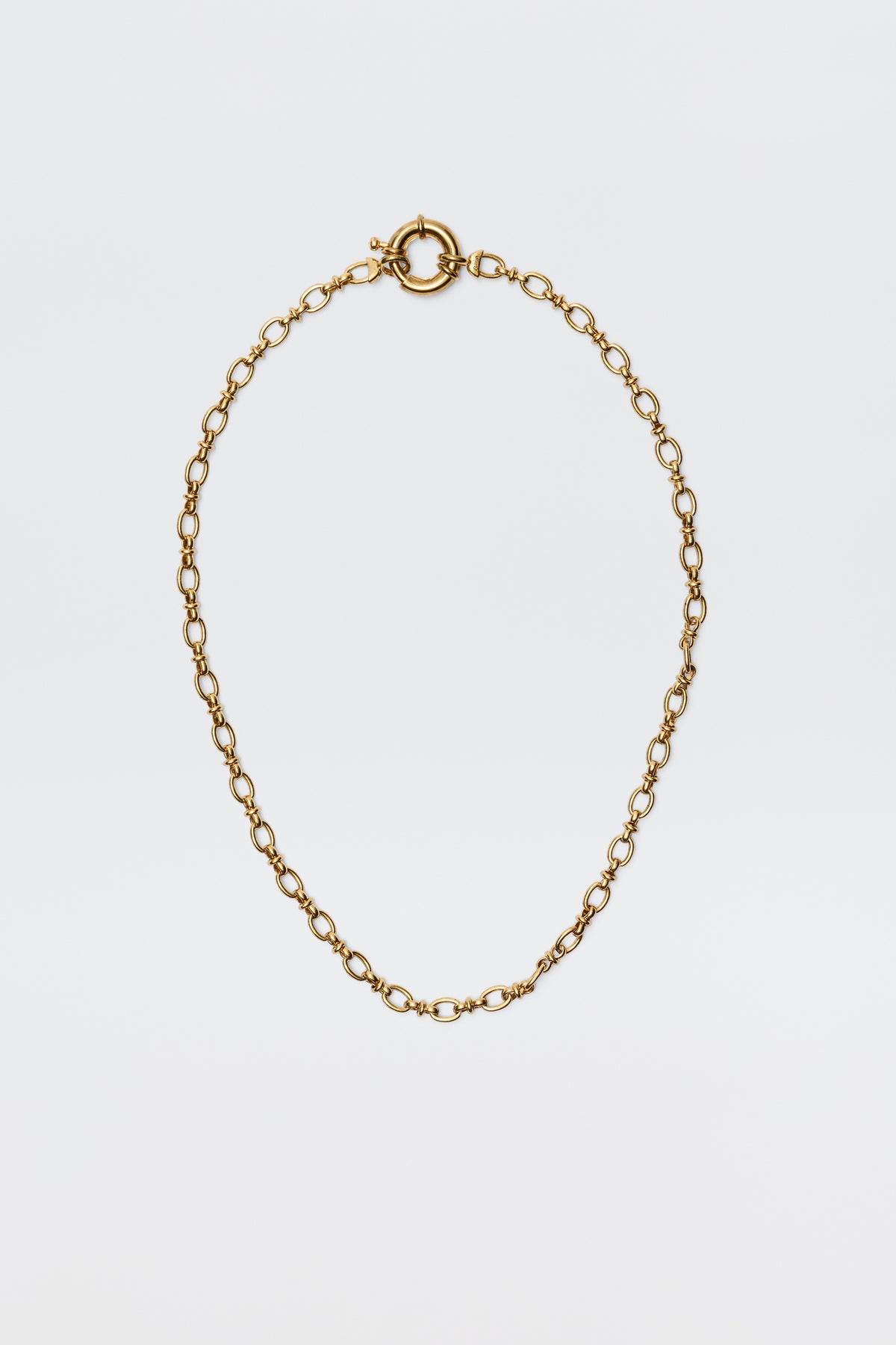 The Lorene - Gold is a vintage-inspired gold-plated necklace with oval links and a round spring ring clasp, elegantly showcased against a plain white background.