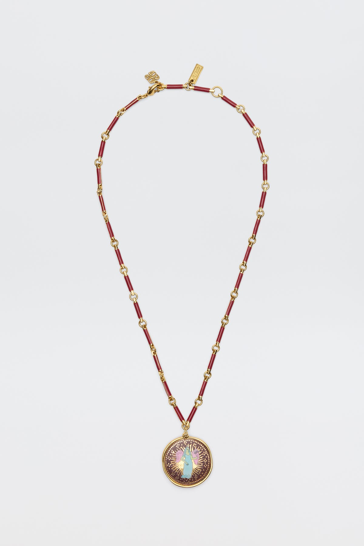 Ari - Astro Virgo: A gold and red beaded necklace featuring a round statement disc pendant adorned with a central opal-like stone, encircled by a purple and gold sunburst design, displayed on a white background.
