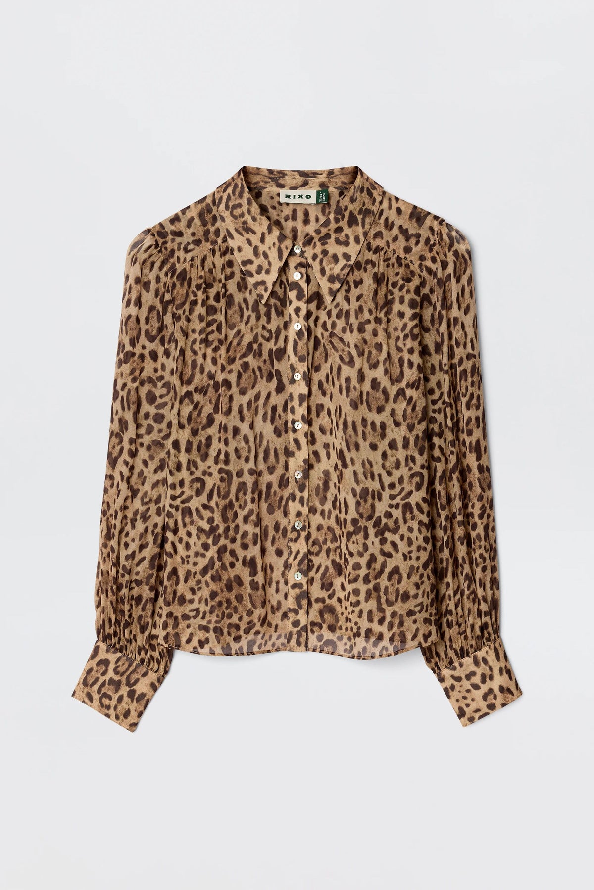 The Blake - Mila Leopard Brown is a long-sleeve, button-up blouse from RIXO with a brown and black leopard print, pointed collar, and cuffed sleeves for a vintage-inspired look.