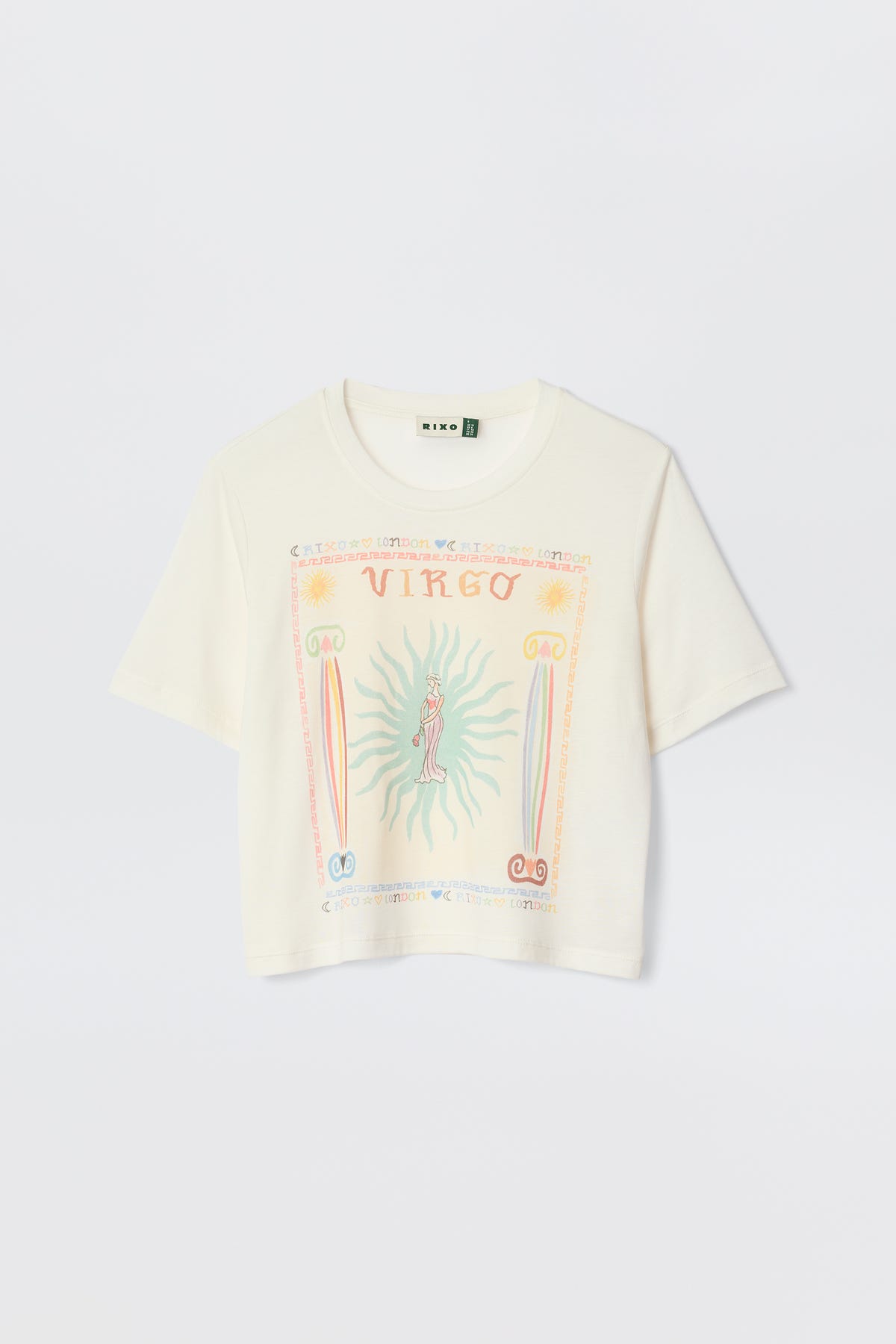 The Ria - Virgo is a white cropped short-sleeve t-shirt with a colorful artistic Virgo print, suns, symbols, and pastel accents on the front. Perfect for pairing with RIXO skirts. Shown against a plain white background.