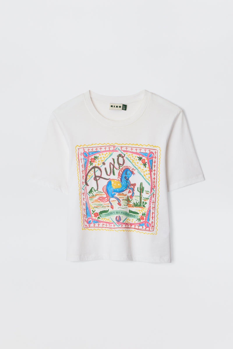 The Ria - Rider White T-shirt is a white cropped cotton-jersey top with a colorful front graphic featuring a blue horse, cacti, flowers, and "Rixo" in decorative script above the hem.