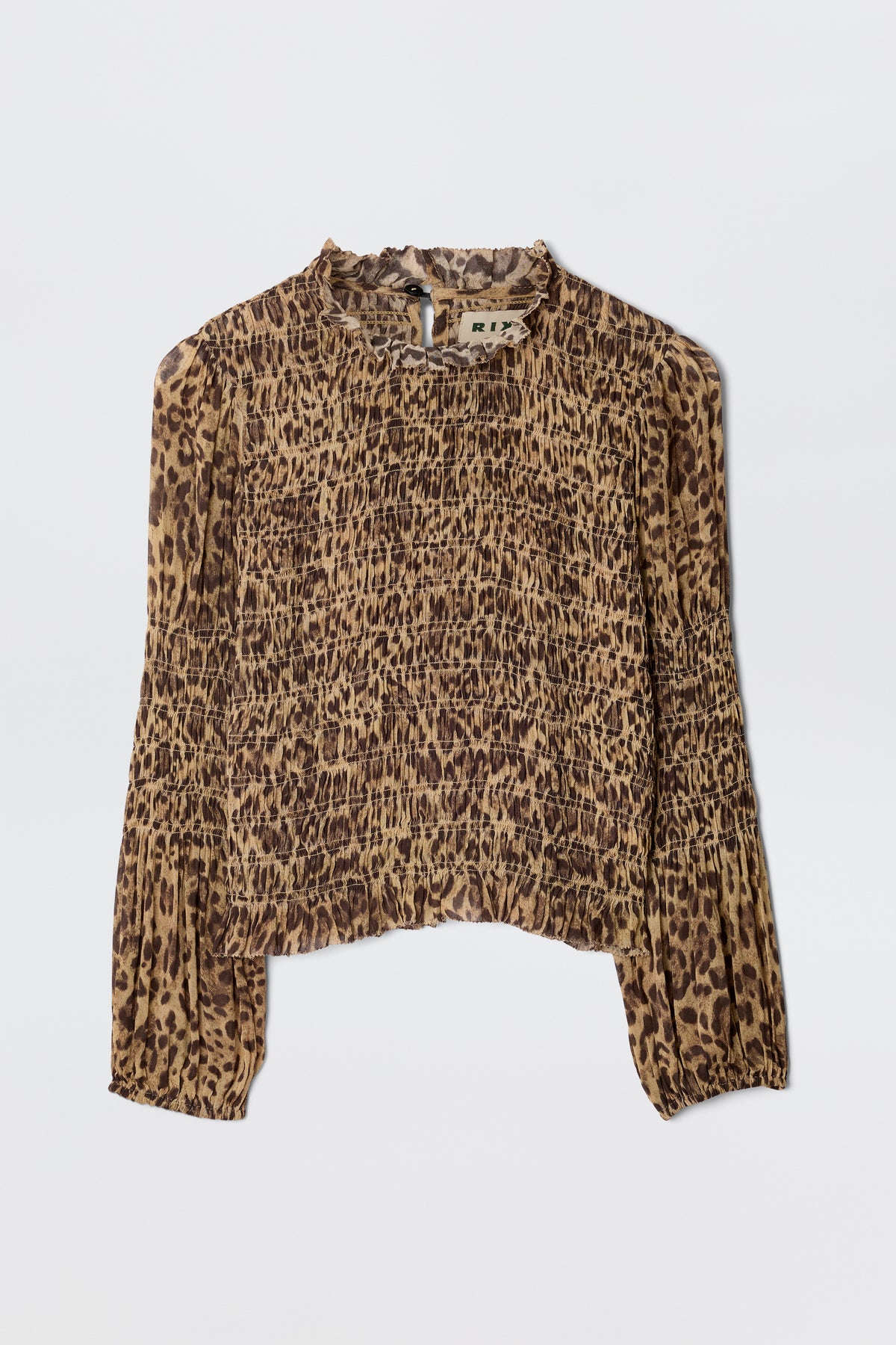 The Gardenia - Mila Leopard Brown blouse features a vintage-inspired, long-sleeve, high-neck design with a brown and black leopard print on lightweight georgette fabric, accented by elegant ruffle trim.