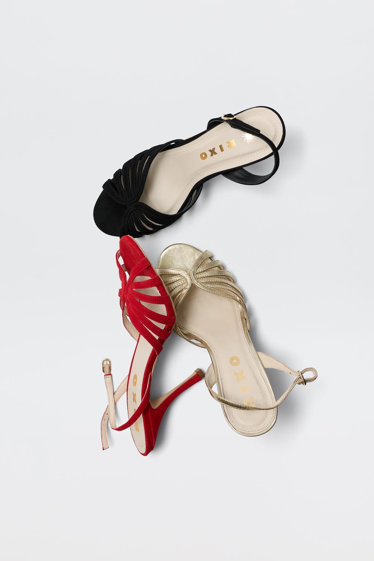 The glamorous Mavi - Black heeled sandal is displayed on a white background, featuring an open toe, ankle strap, and the RIXO logo on the insole—ideal for elevating any outfit.