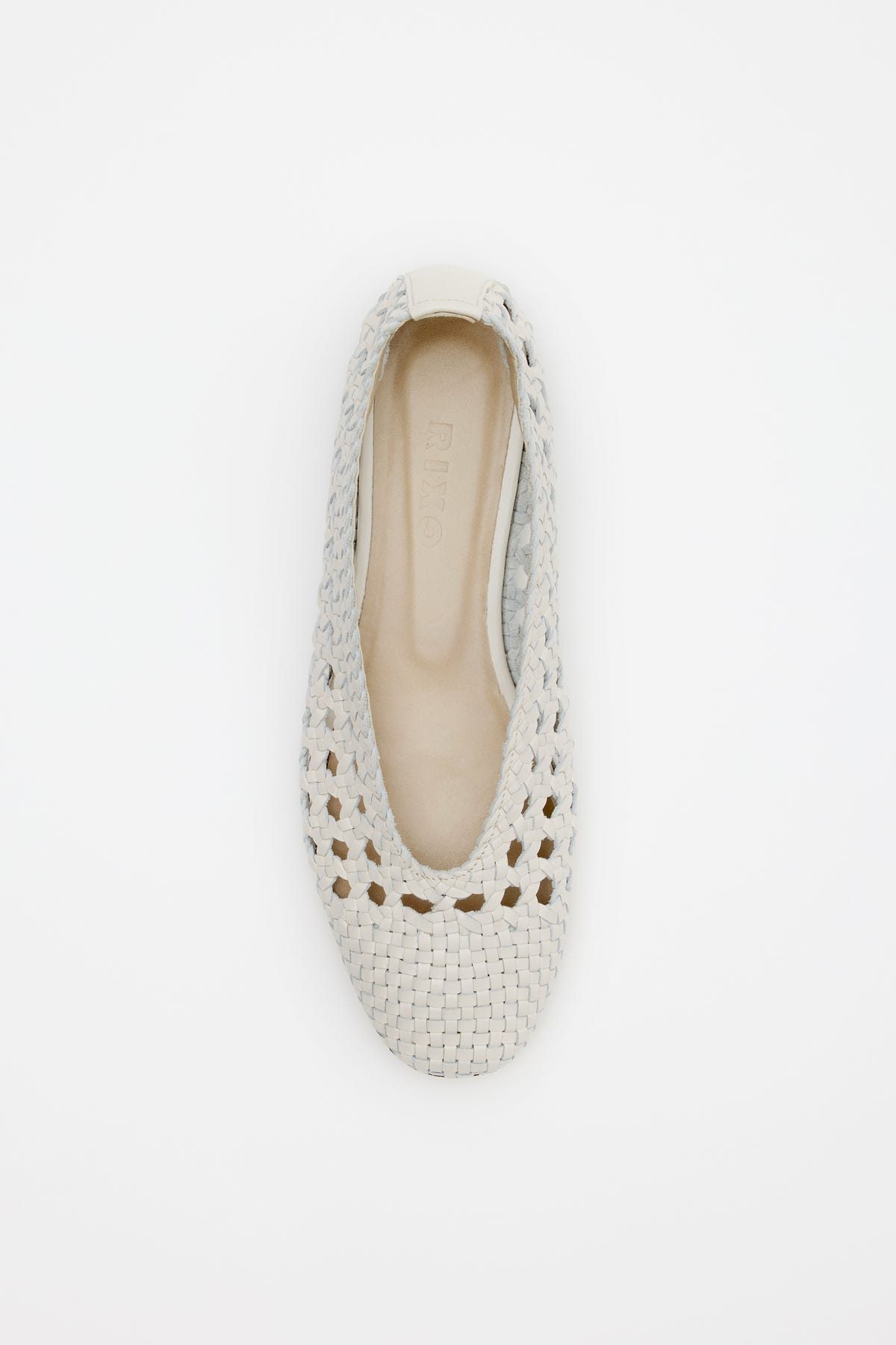 A top view of the Marlia - Cream flat shoe, featuring a light beige woven design with a round toe and open-weave pattern, displayed on a white background.