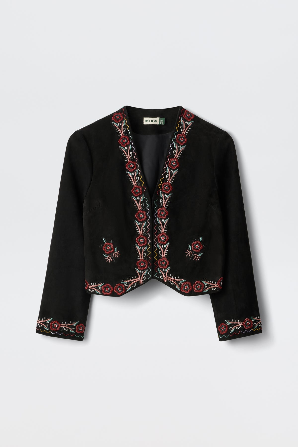 Oliwia - Roselle Embellishment Black: A black cropped jacket with long sleeves, showcasing red and cream floral embroidery along the edges, cuffs, and hem. Features an open front design and is displayed on a white background.